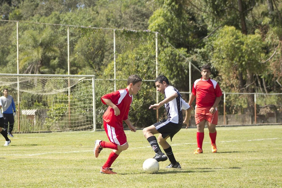 boys playing football