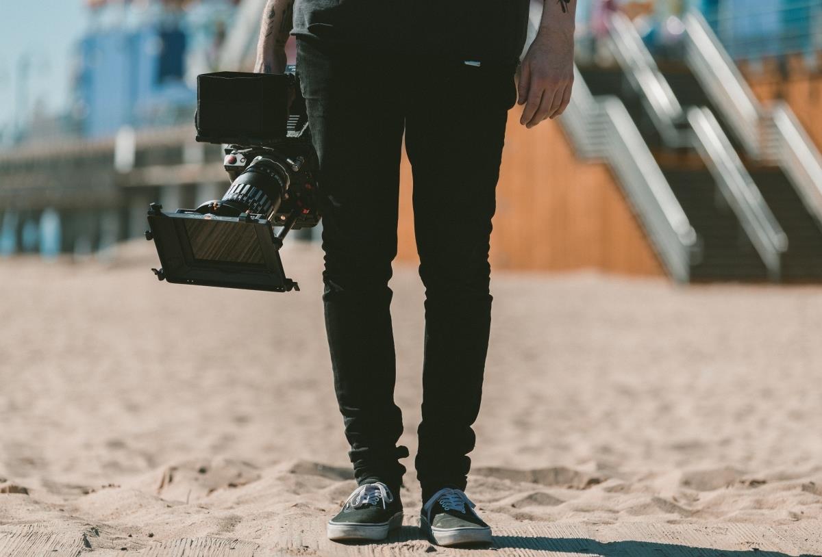 person holding a video camera