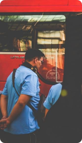 Man getting on a bus