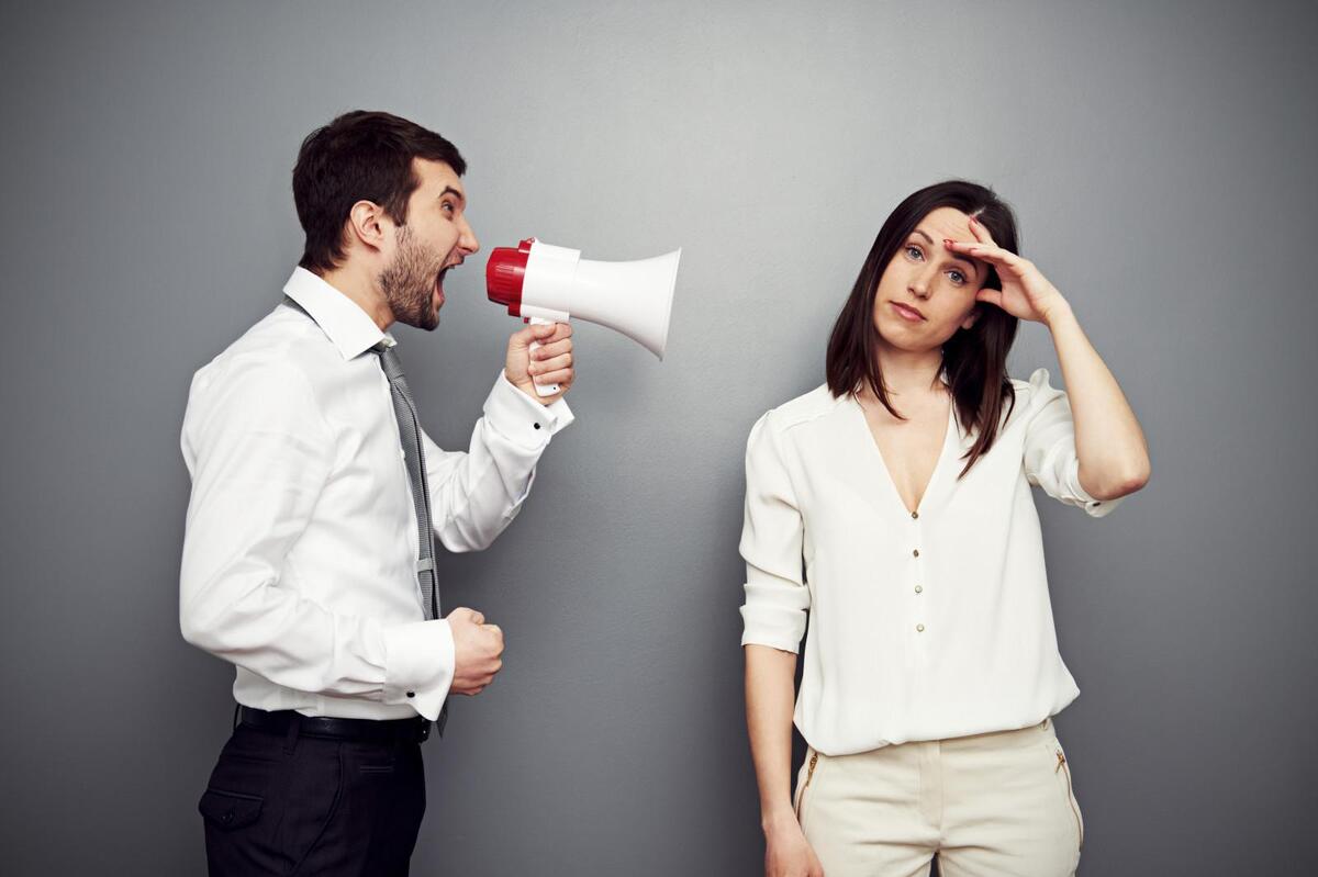 man talking loudly through a megaphone